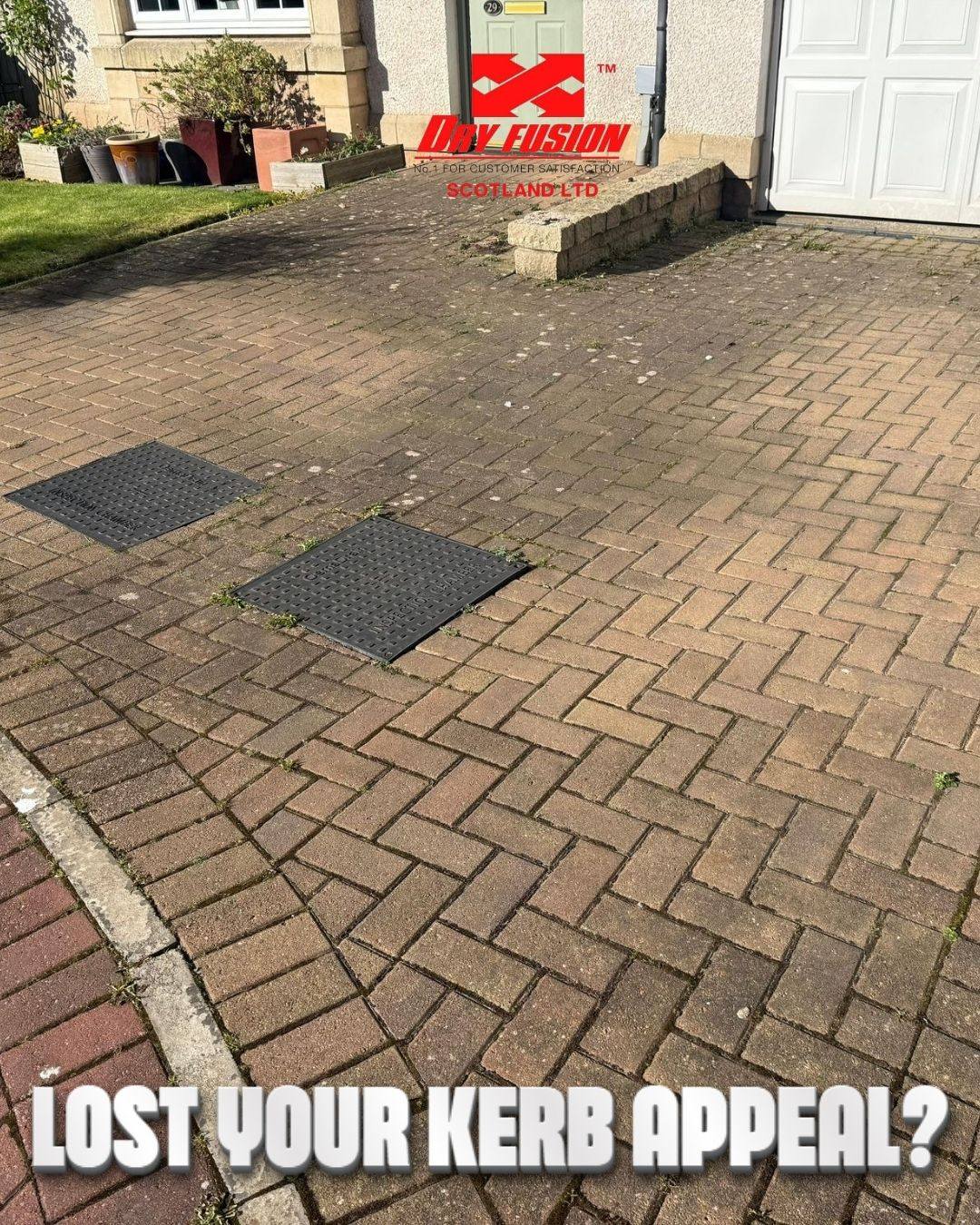 dirty driveway with drain covers